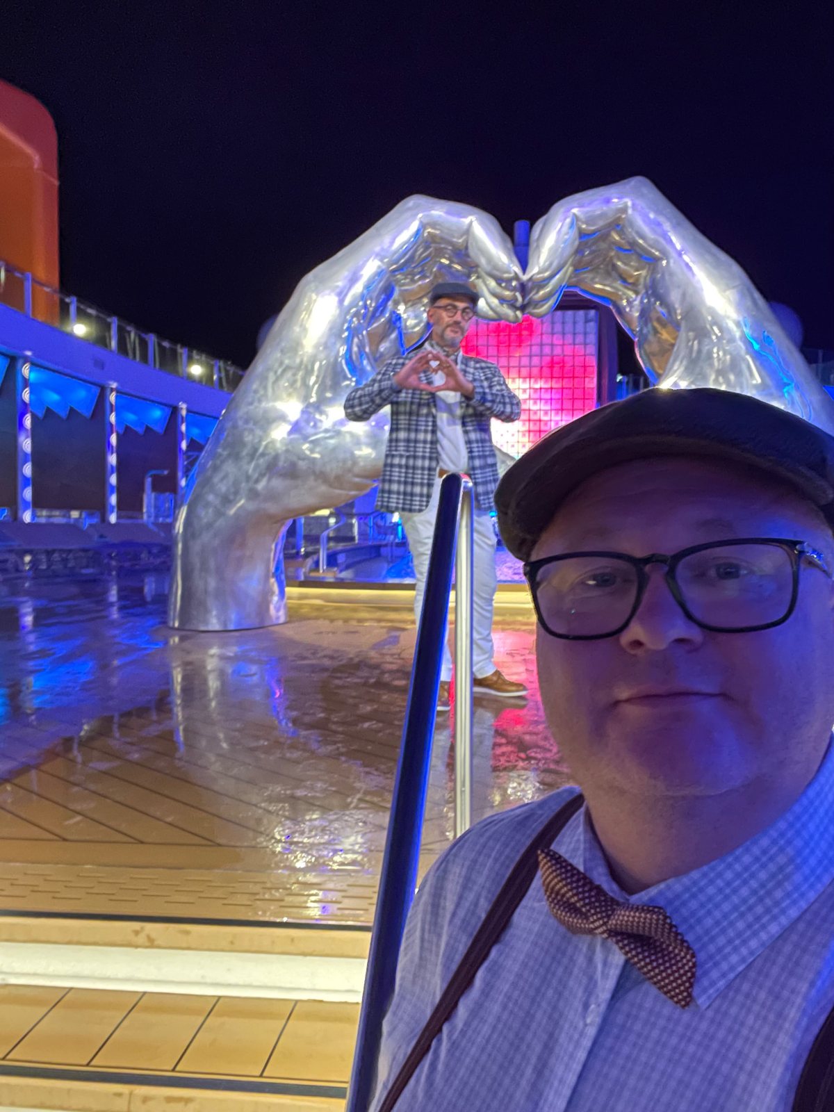 Matthew on the deck of a Celebrity Cruise Lines ship at night, ready for sail-away