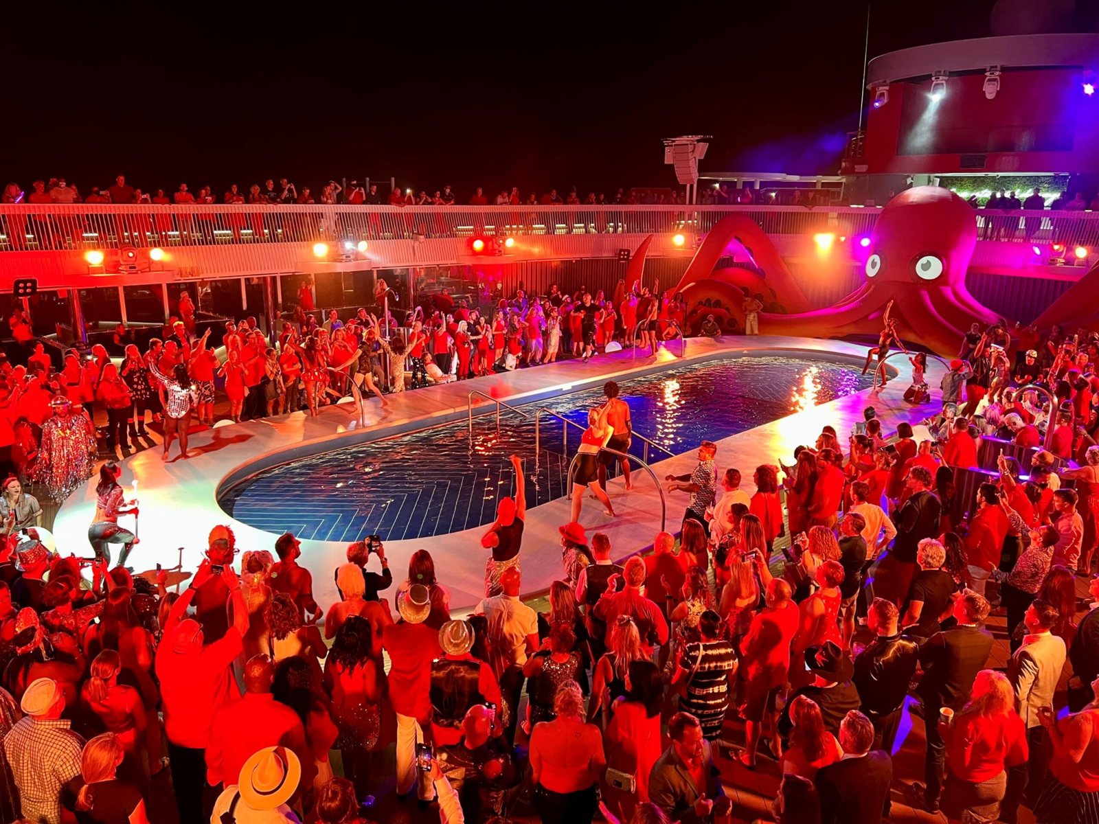 Scarlet Night on deck: a sea of red outfits around the pool
