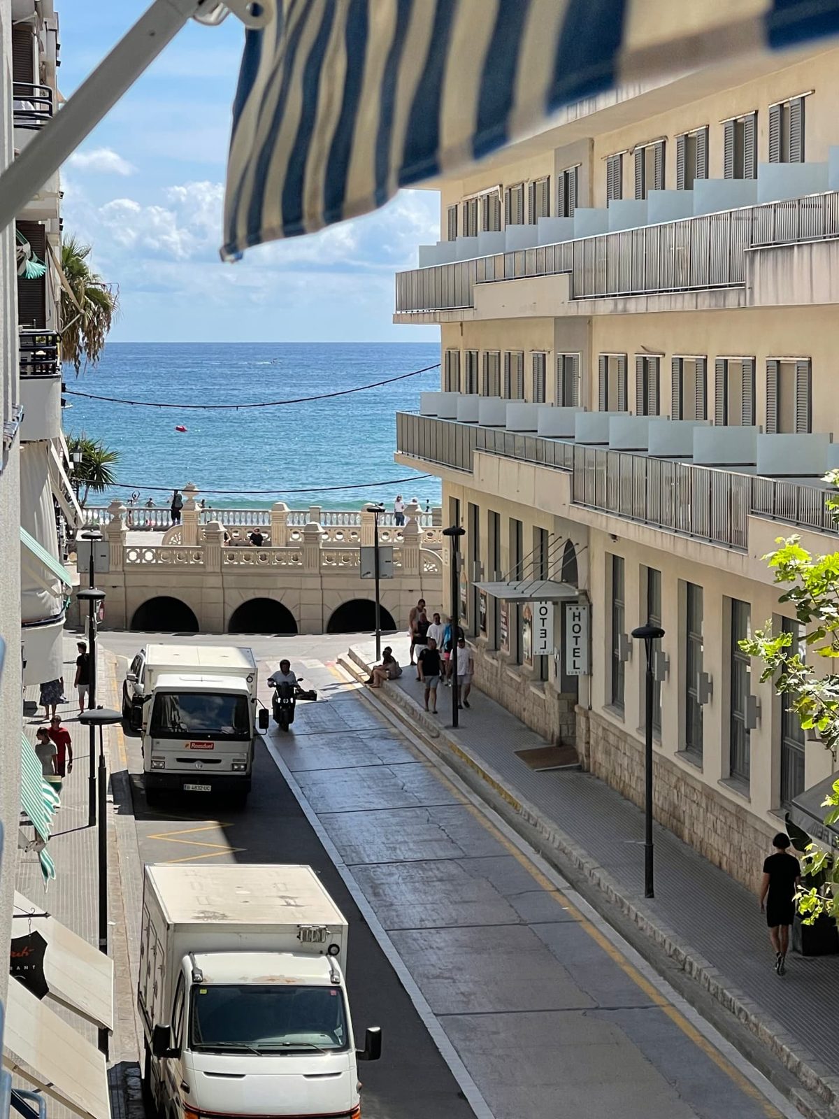 Looking down a Sitges street toward the sea, past Hotel Subur