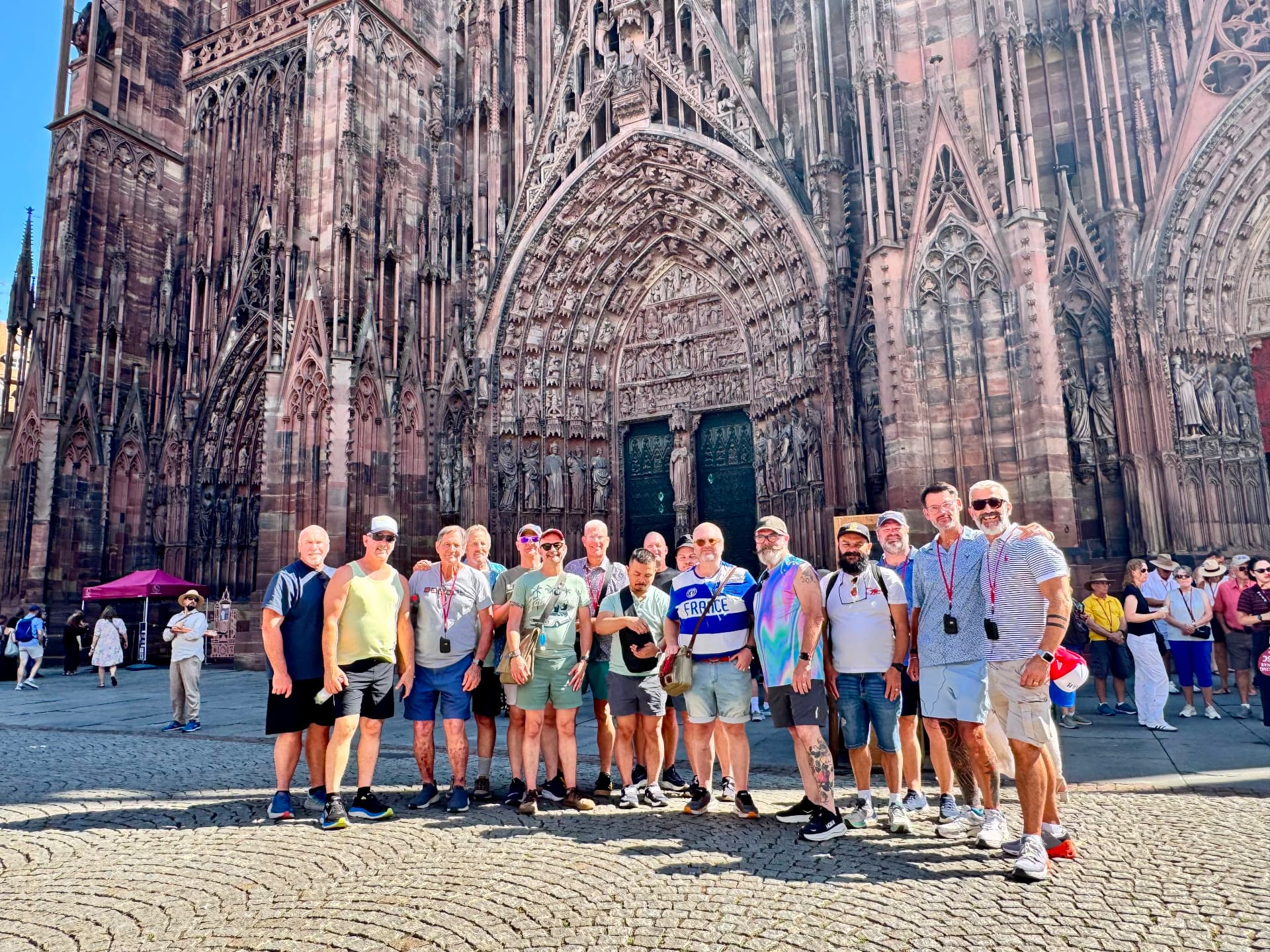 CruisingBears group posing together outside Strasbourg Cathedral in France