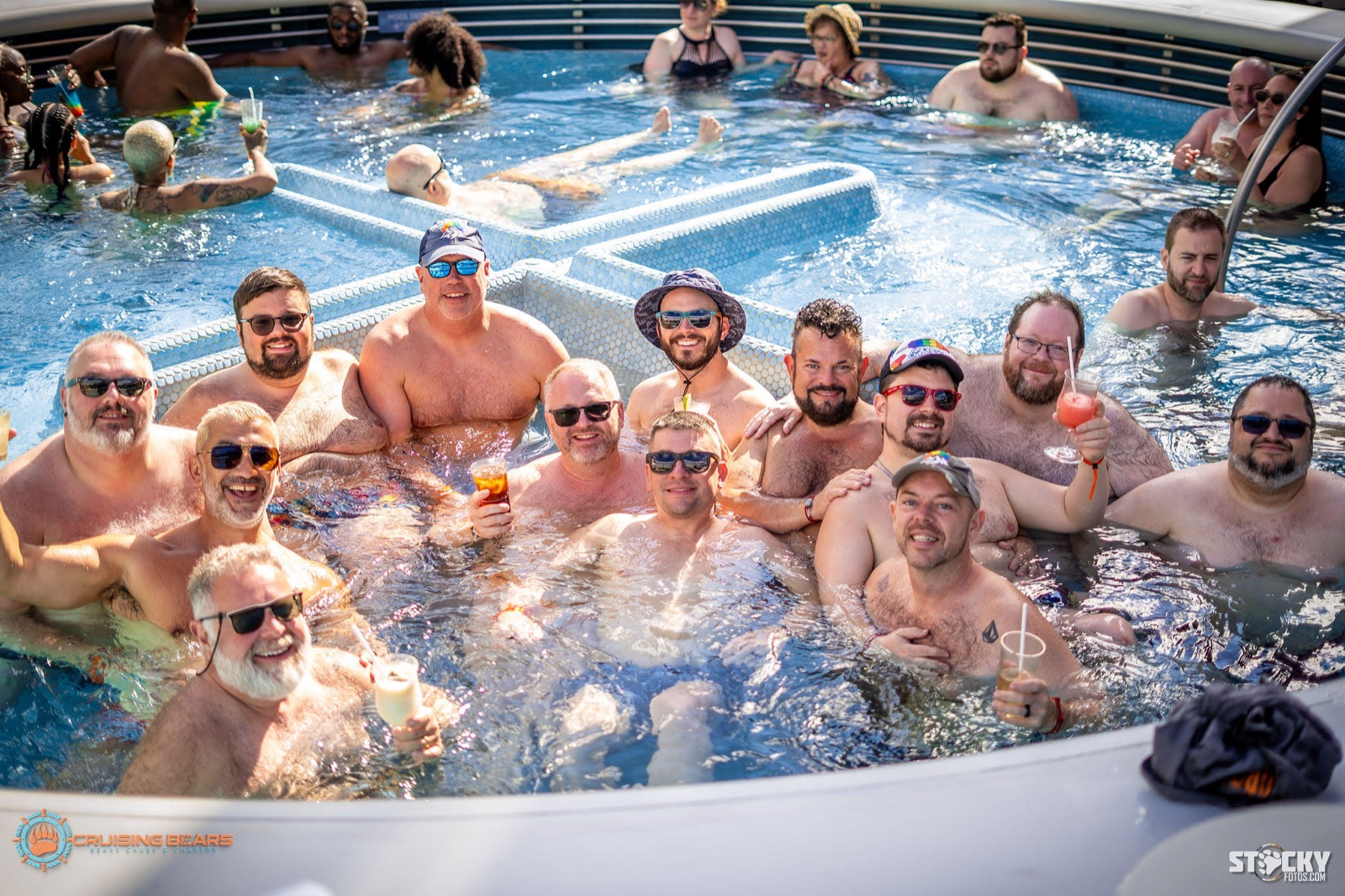 Crew relaxing in the hot tub with colorful drinks