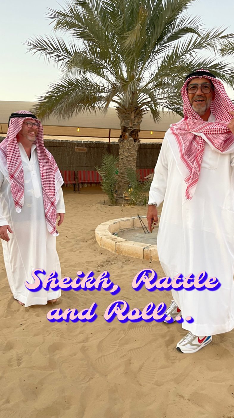 Two travelers in traditional dress with the caption Sheikh, Rattle and Roll