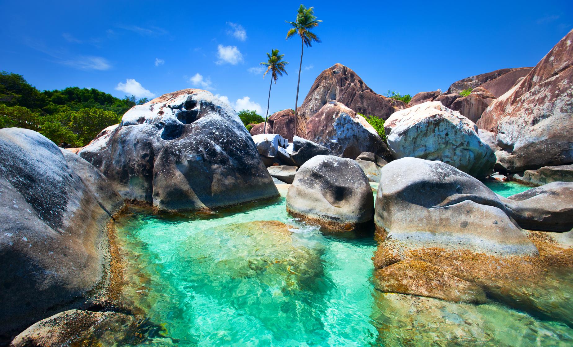Turquoise tide pools between giant granite boulders at The Baths, Virgin Gorda