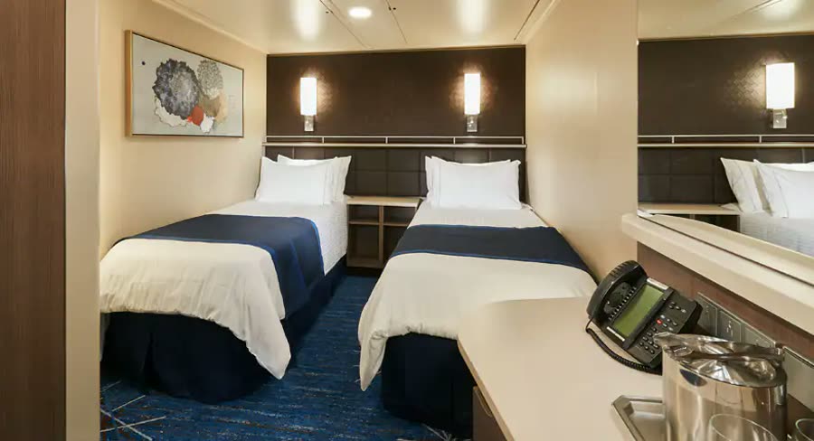 Norwegian inside stateroom with two twin beds and desk