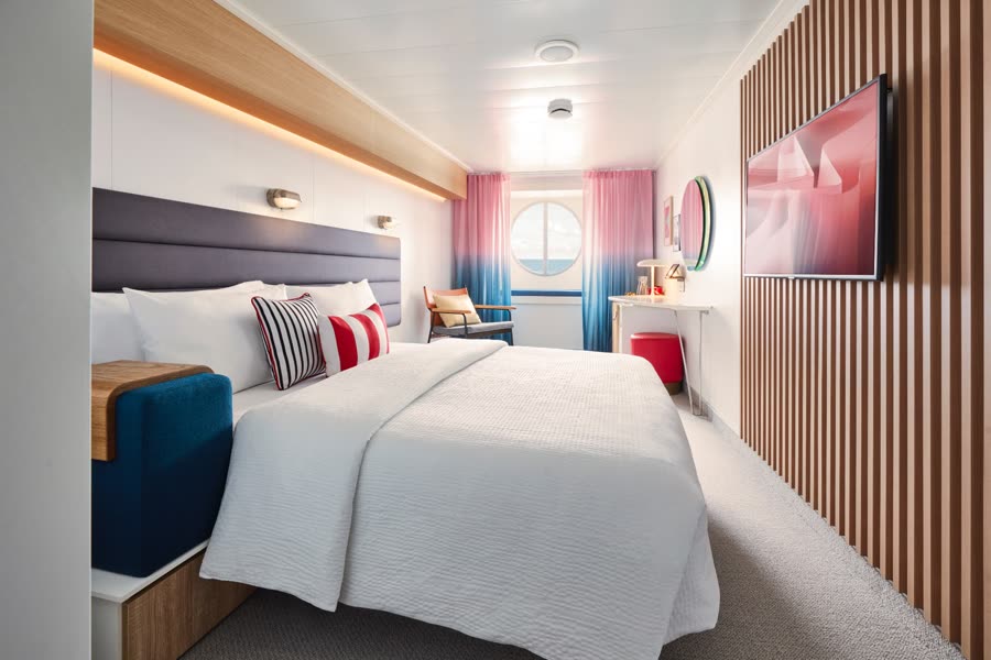 Sea View cabin with porthole window and queen bed