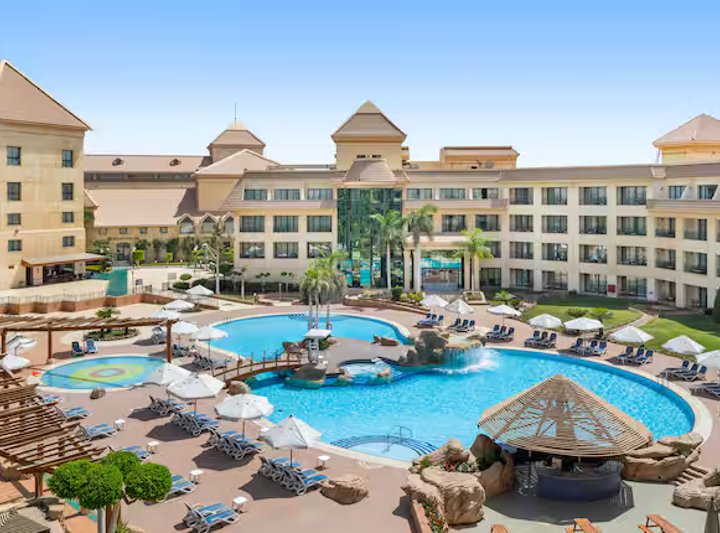 Resort pools and palms at the Hilton Pyramids Golf